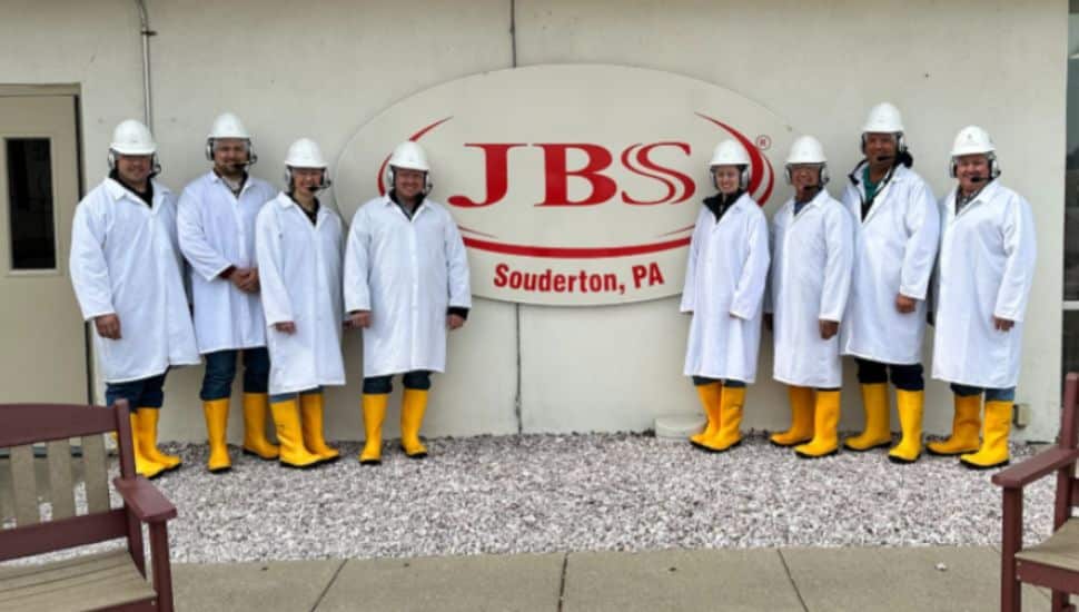 Uniformed workers at the JBS meatpacking plant in Souderton.