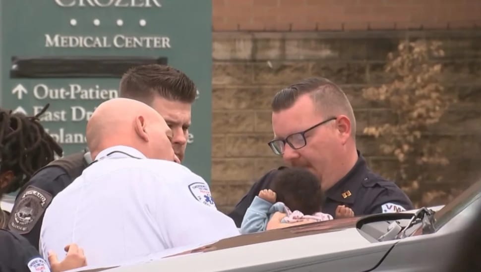 Police and paramedics with 5-month-old Shyanne Glen outside the closed Crozer-Chester Medical Center in Upland.