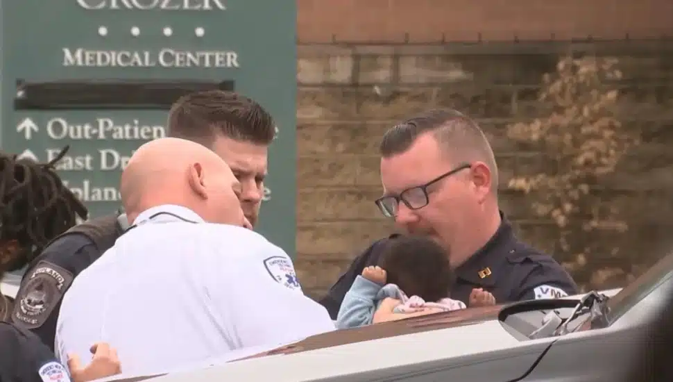 Police and paramedics with 5-month-old Shyanne Glen outside the closed Crozer-Chester Medical Center in Upland.