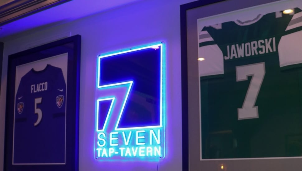 A neon sign for the 7-Tap Tavern.
