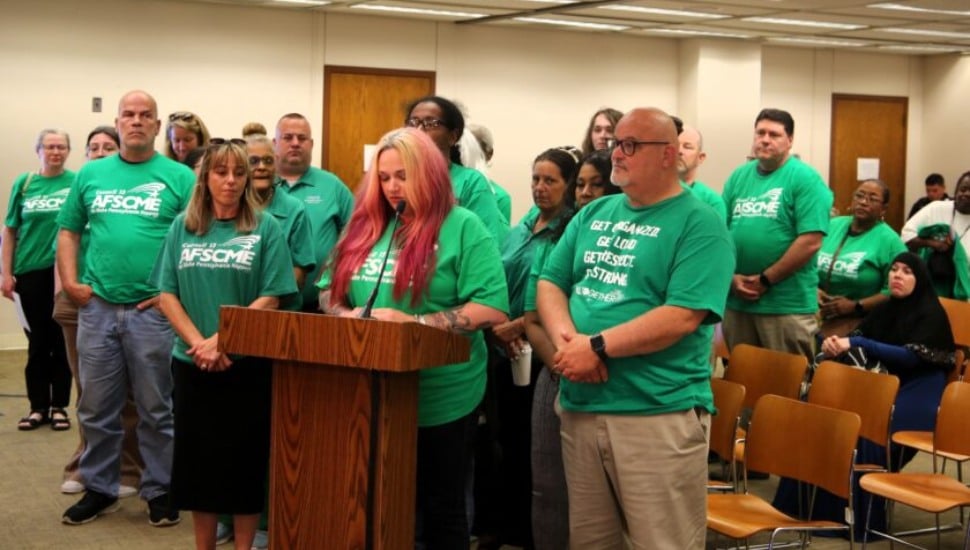 Delaware County Health Department worker Erin Anthony-Russo speaks out surrounded by supportive union members, ask county council for union recognition.