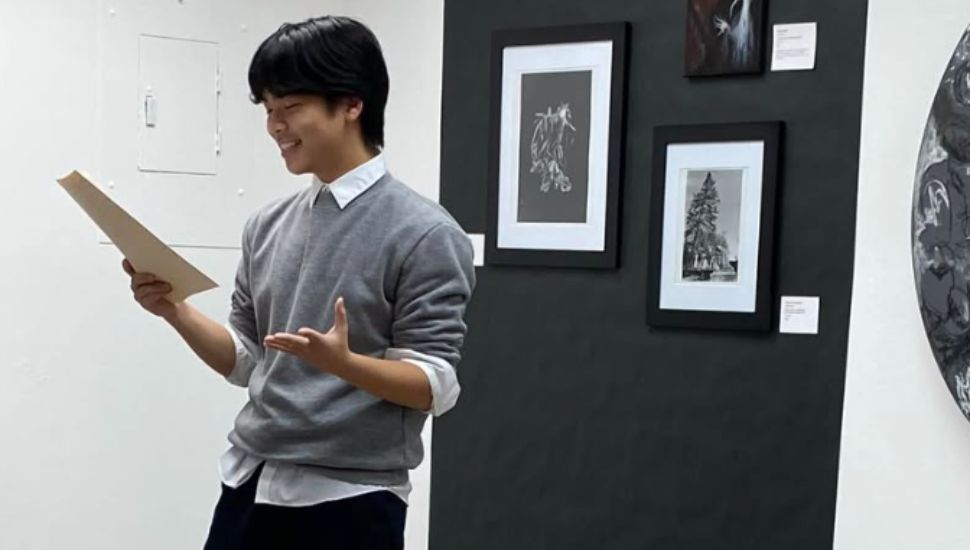 Upper Merion senior Evan Wang reads a poem.