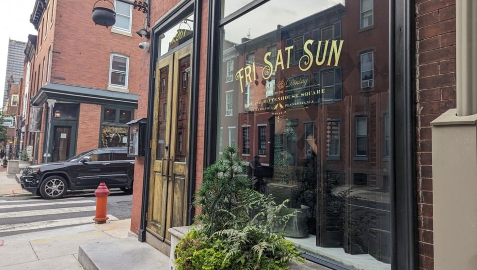 The street-side window of the Friday-Saturday-Sunday restaurant.