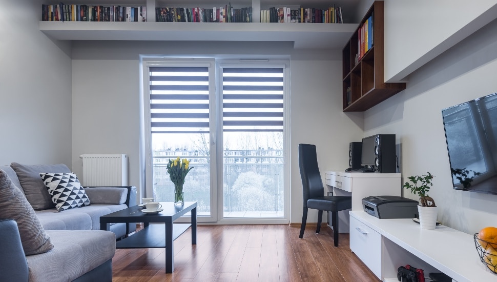A decorated Philadelphia micro-apartment with sofa, chair and other furniture.