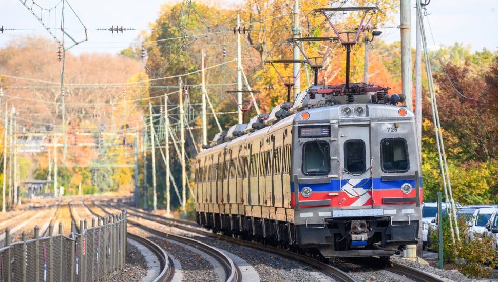A SEPTA train outdoors on a track.