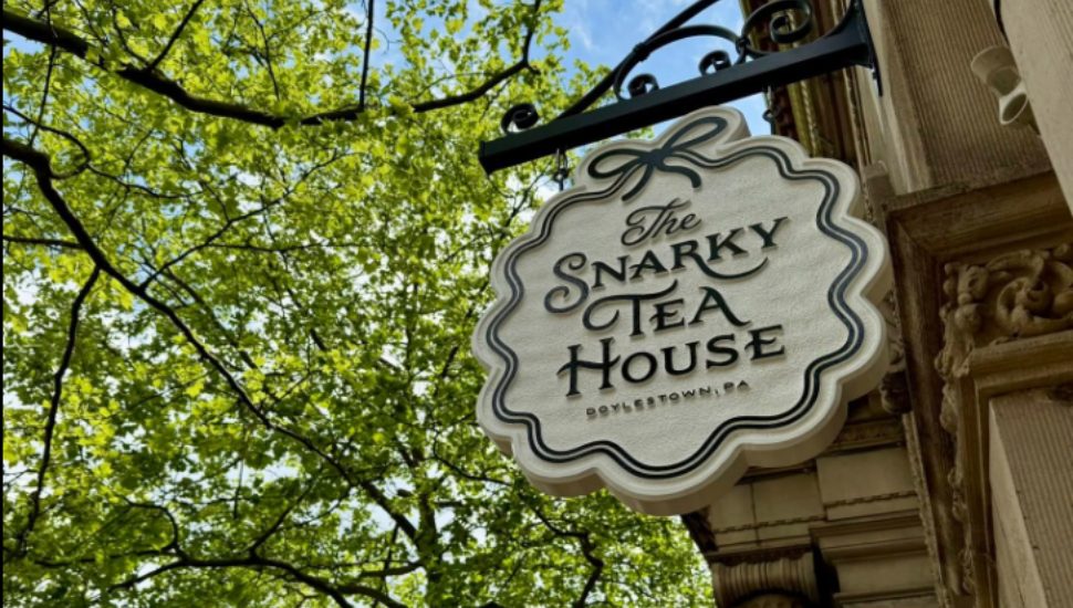 A sign for the The Snarky Tea House.