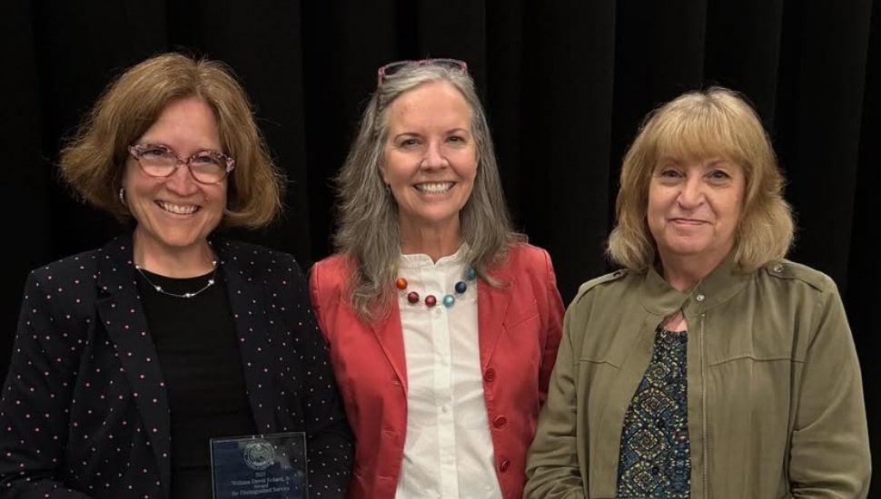 Widener employees Mary Allen (left) and Paula Heider (right) with Widener University President Stacey Robertson (center).