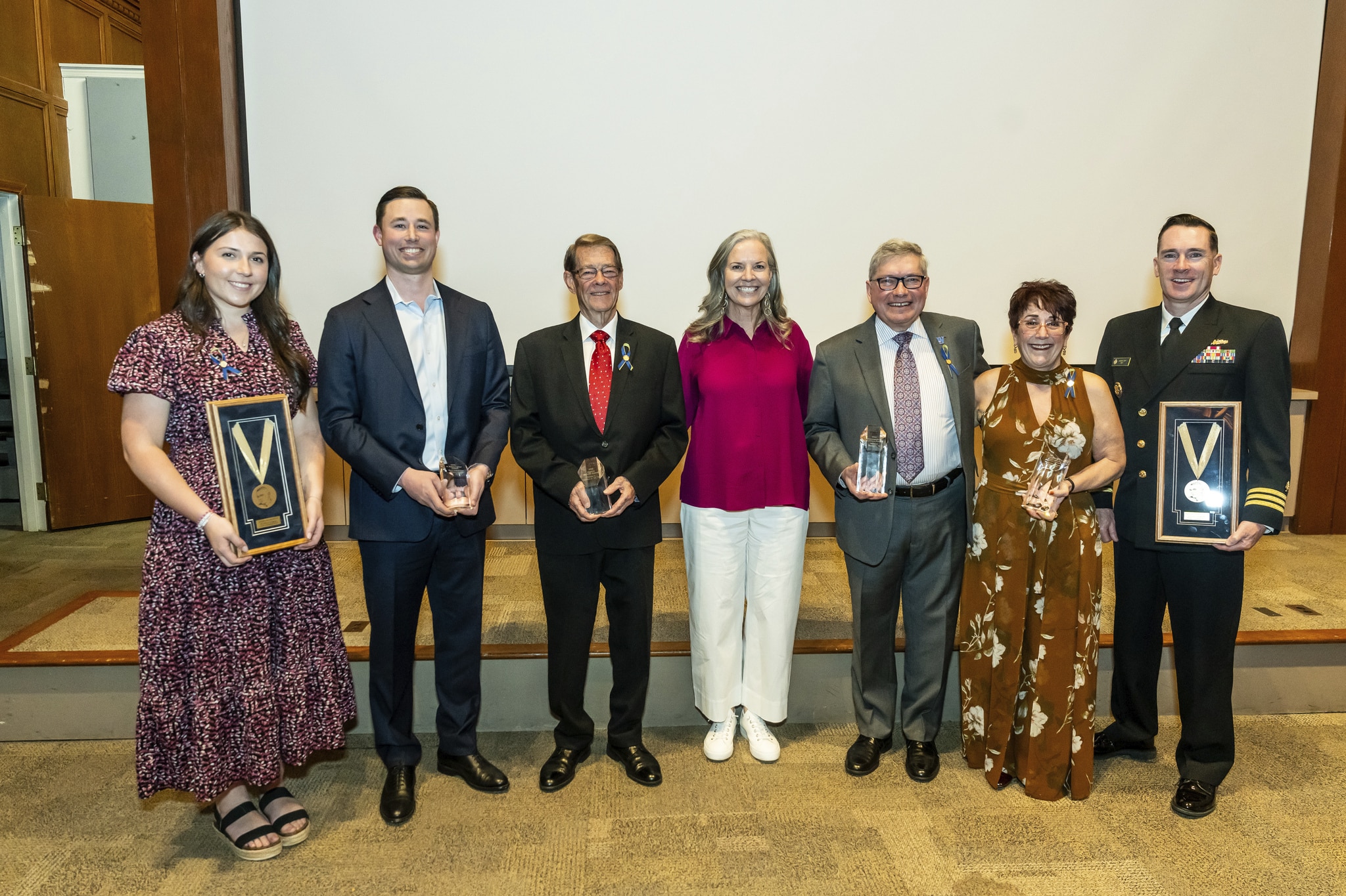 Widener University Alumni Award recipients pose with Widener University President Stacey Robertson (center).