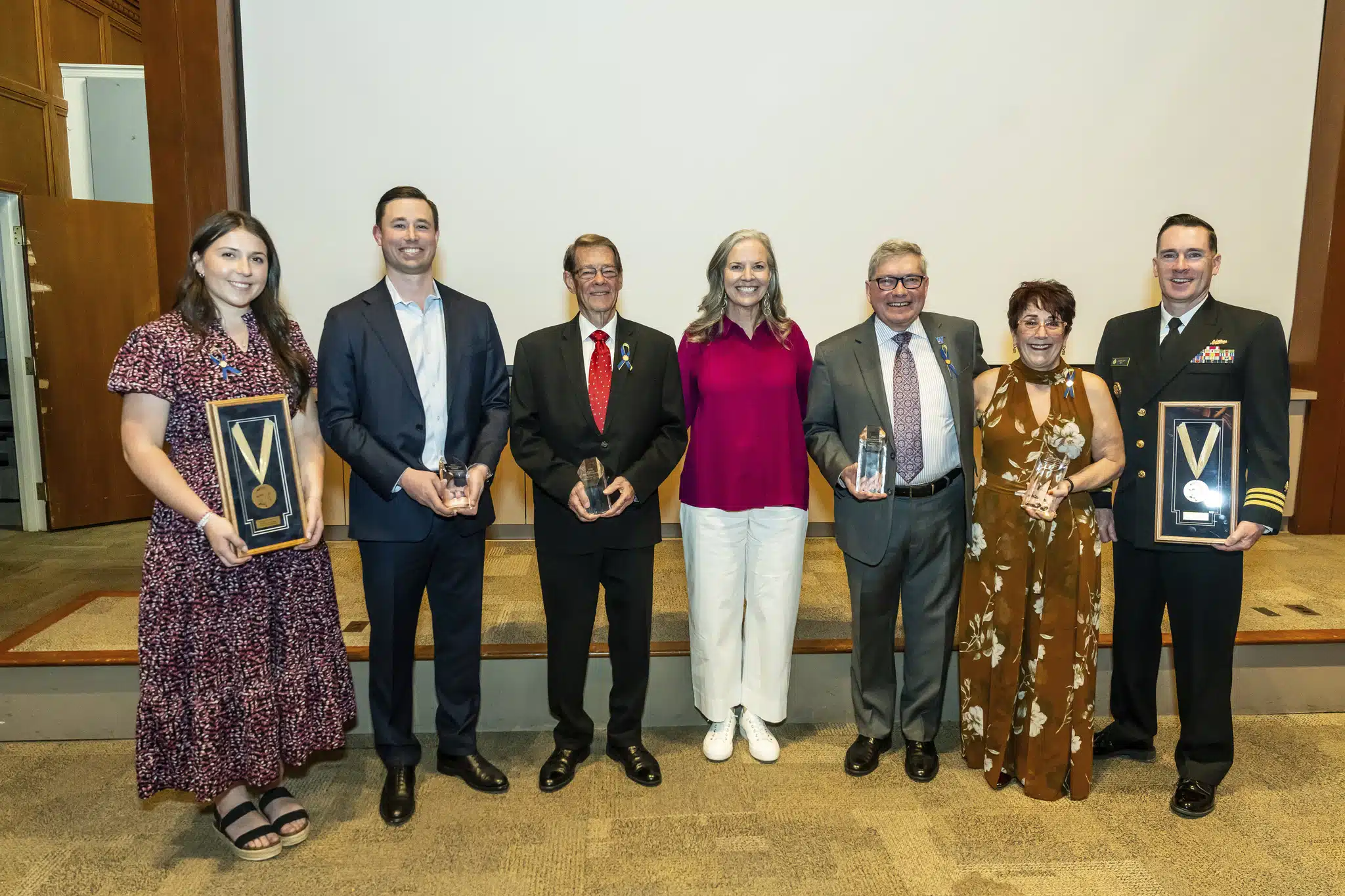 Widener University Alumni Award recipients pose with Widener University President Stacey Robertson (center).