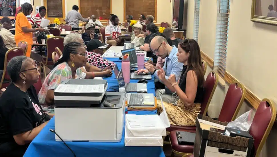 Senior citizens talking to people from the Delaware County Health Department.