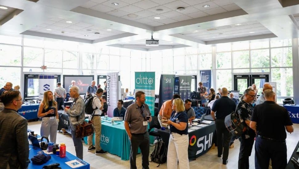 IT and web professional mingle at a conference.