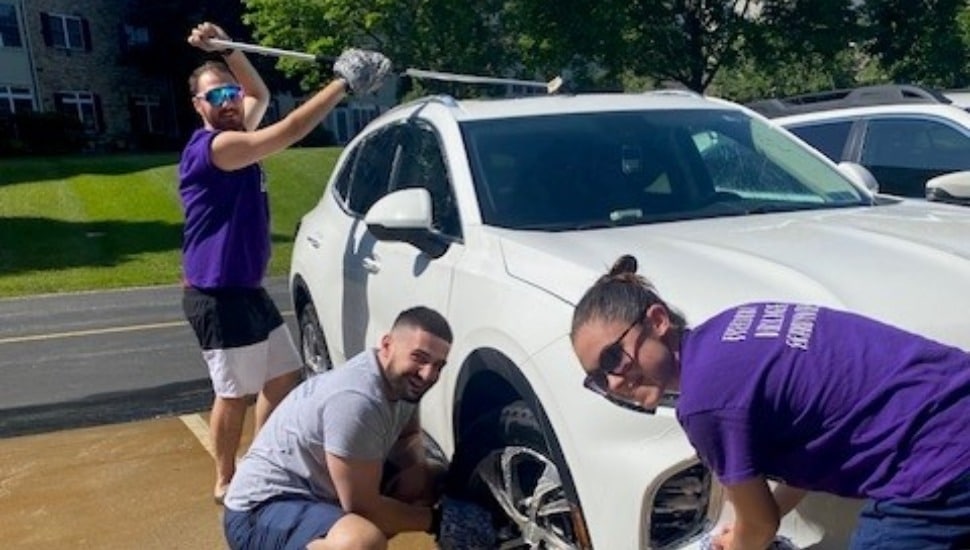 Volunteers wash a car, one of the many fundraising events for the Alzheimer's Association's Longest Day Initiatives.