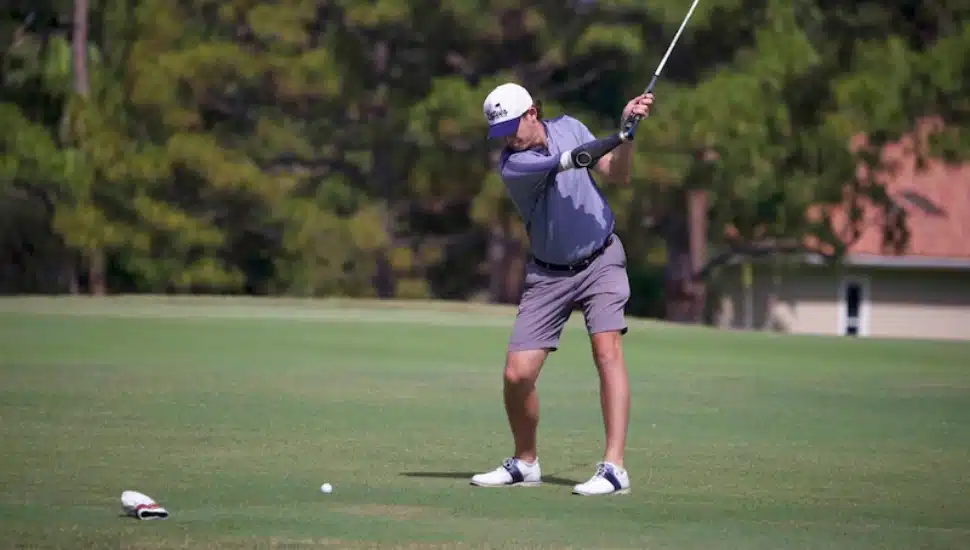 Andrew Austin gets his golf swing ready.