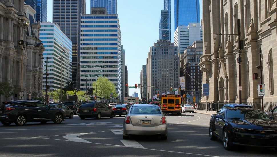Cars in downtown traffic.