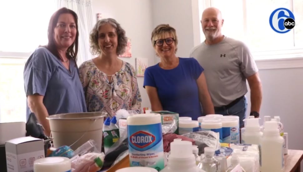 Rachel McGonigle of Havertown with other volunters at Compassion United Havertown standing in front of supplies.