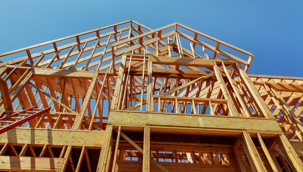 The wooden frame of a house under construction.