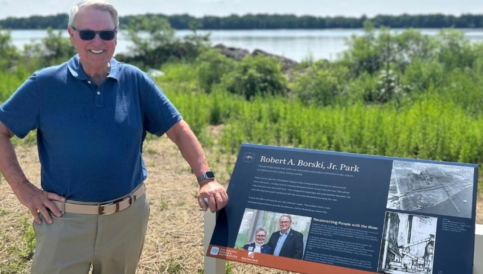 A man stands at the information post at the new Robert A. Borski Jr. Park.