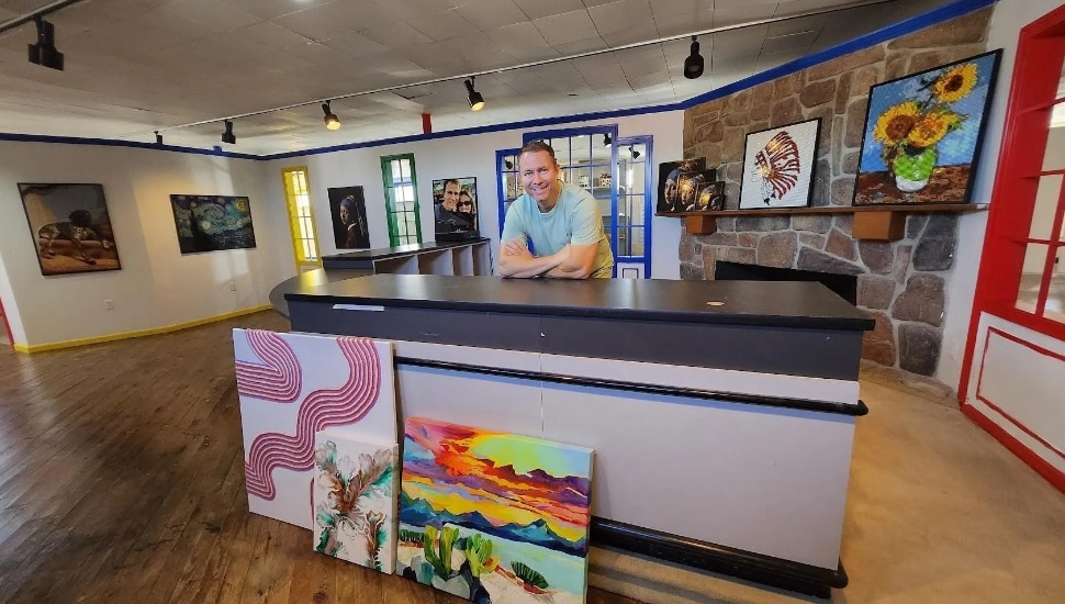 A man at a front desk at Shane Cloyd, an engineering firm.