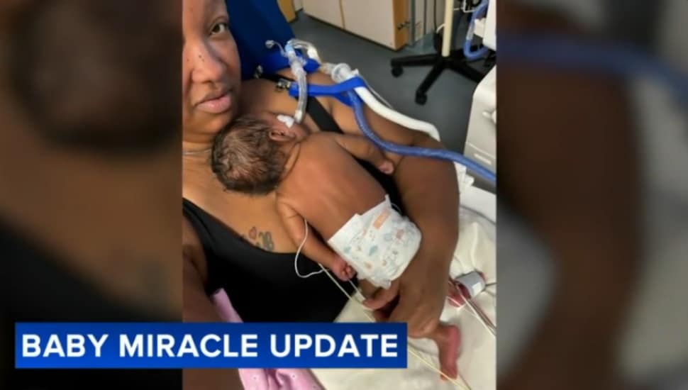Tylicia Bell holds her granddaughter, Tanyiah Miracle Bell.