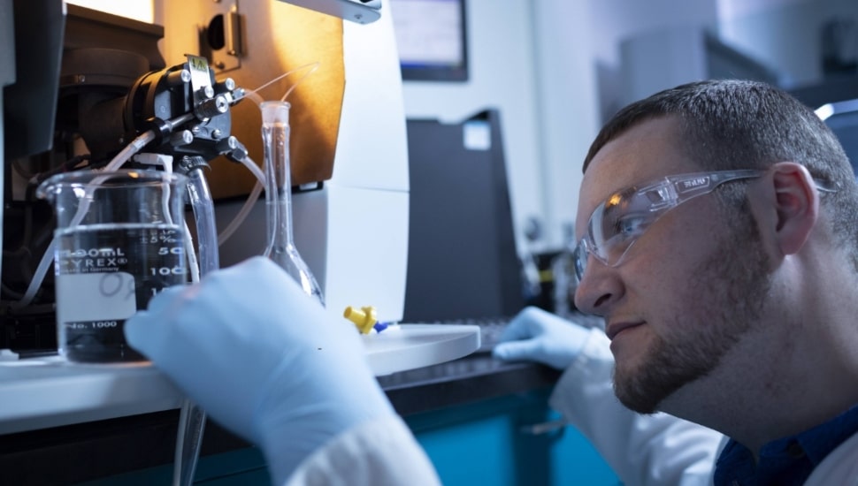 An employee at CSL Behring works on a project.