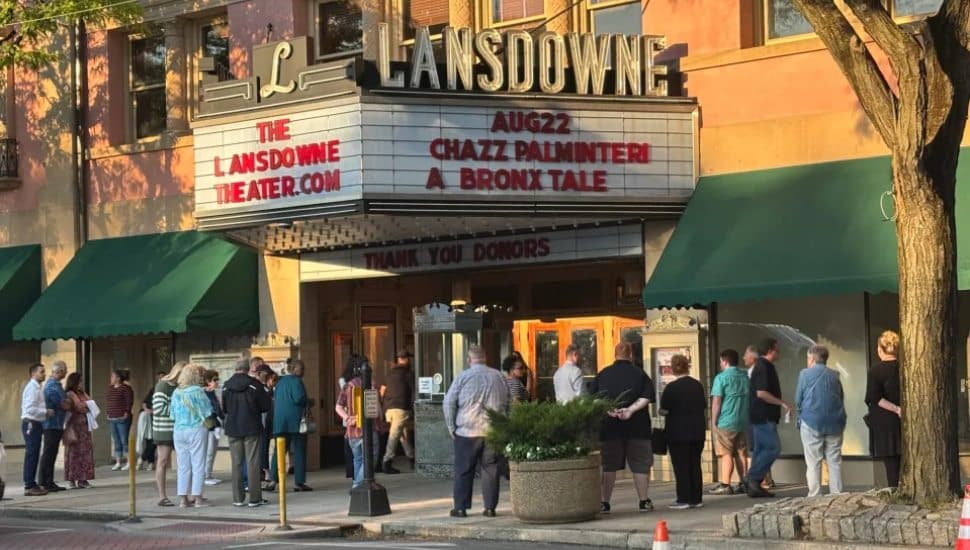 People gather outside the newly-restored and reopened Lansdowne Theater.