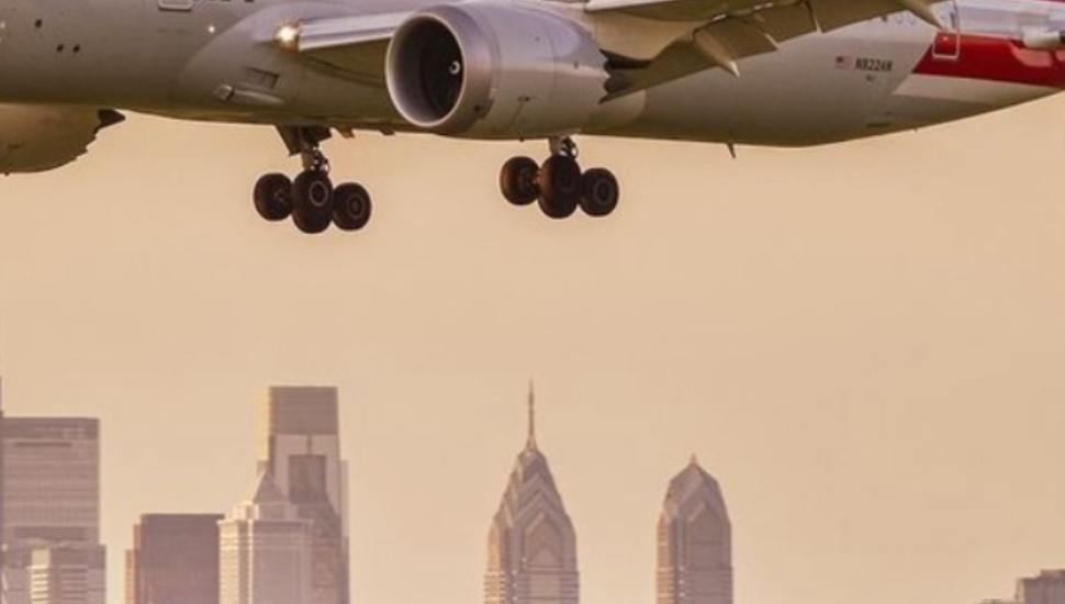 The undercarriage of a plane in flight at Philadelphia International Airport.
