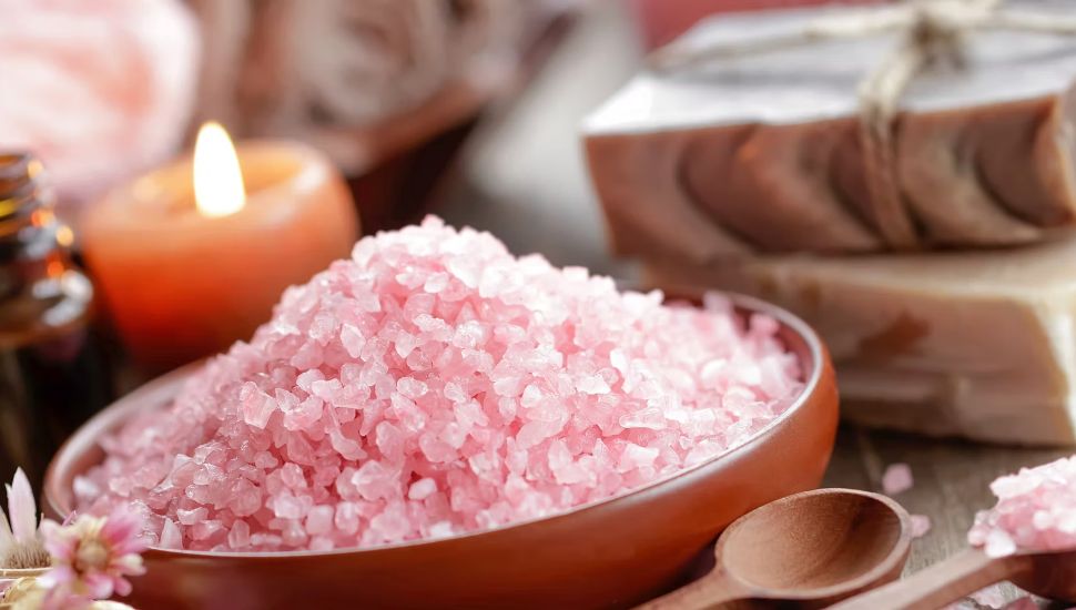A bowl filled with pink salt.