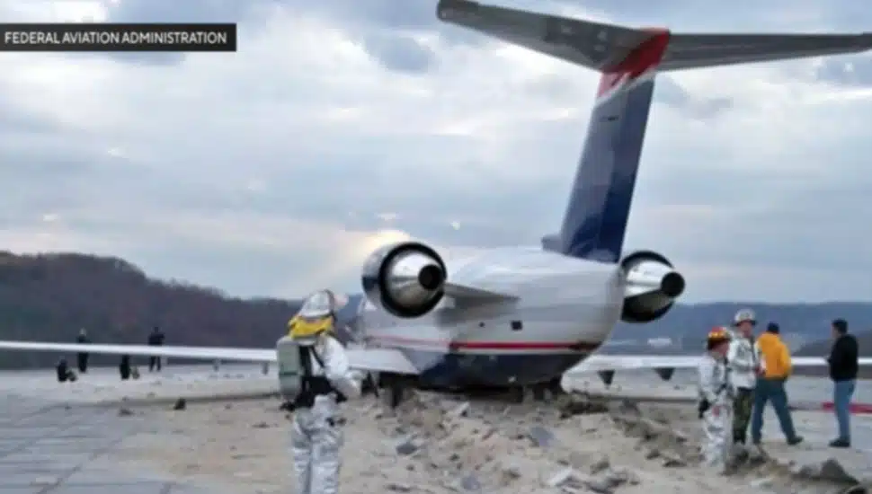 A plane that overshot the runway is stopped by a EMAS system.