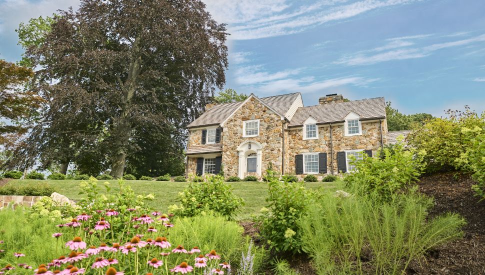 A featured home with trees and a yard featured in Chester County Day's tour.