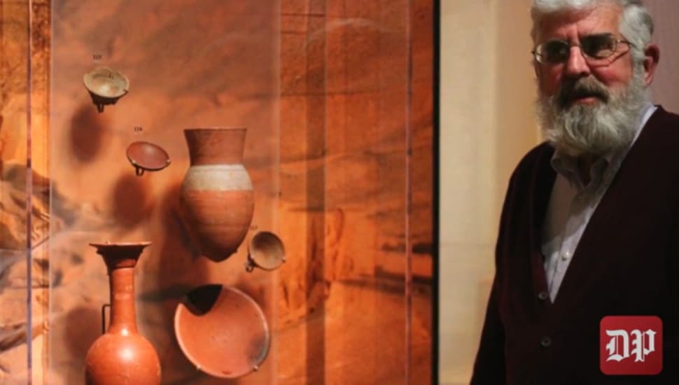 Dr. Patrick E. McGovern with some artifacts.
