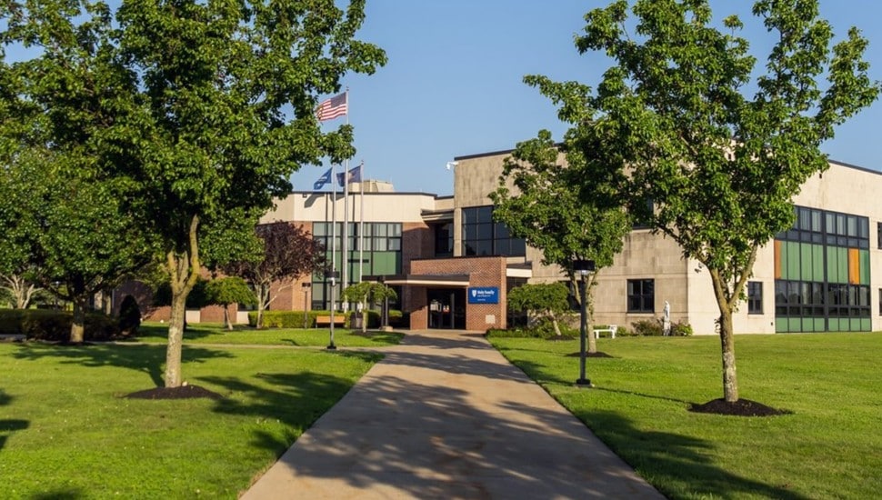 Walkway leading to building on college campus.