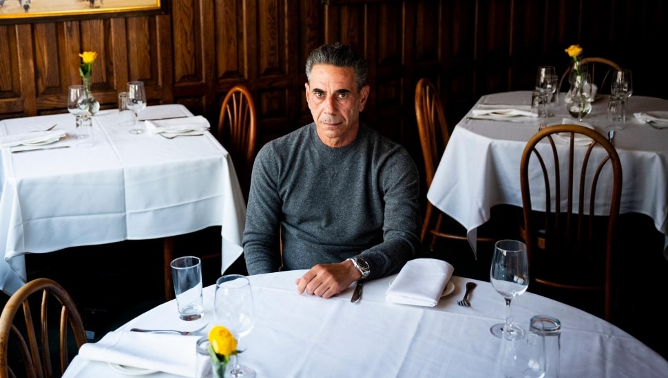 Joey Merlino at a restaurant set table.