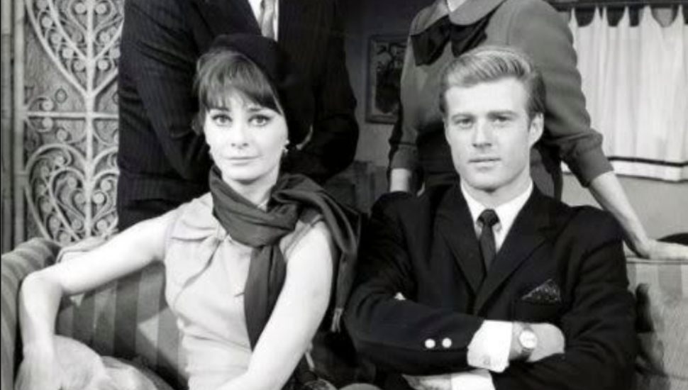 A young Robert Redford and an actress.