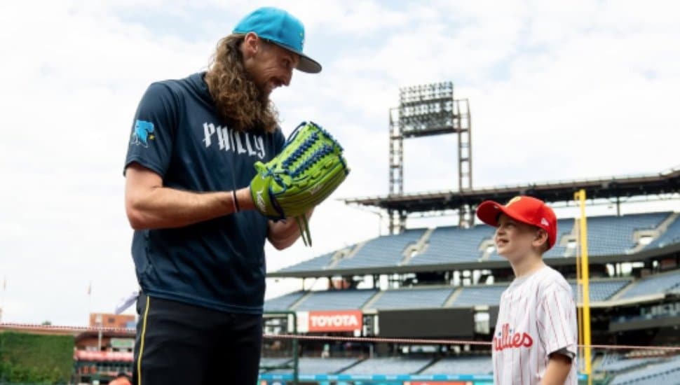 Phillies relief pitcher Matt Strahm with 8-yeare-old Lincoln Harison.