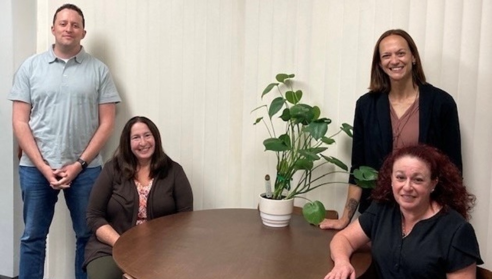 Four therapists gather at roundtable.