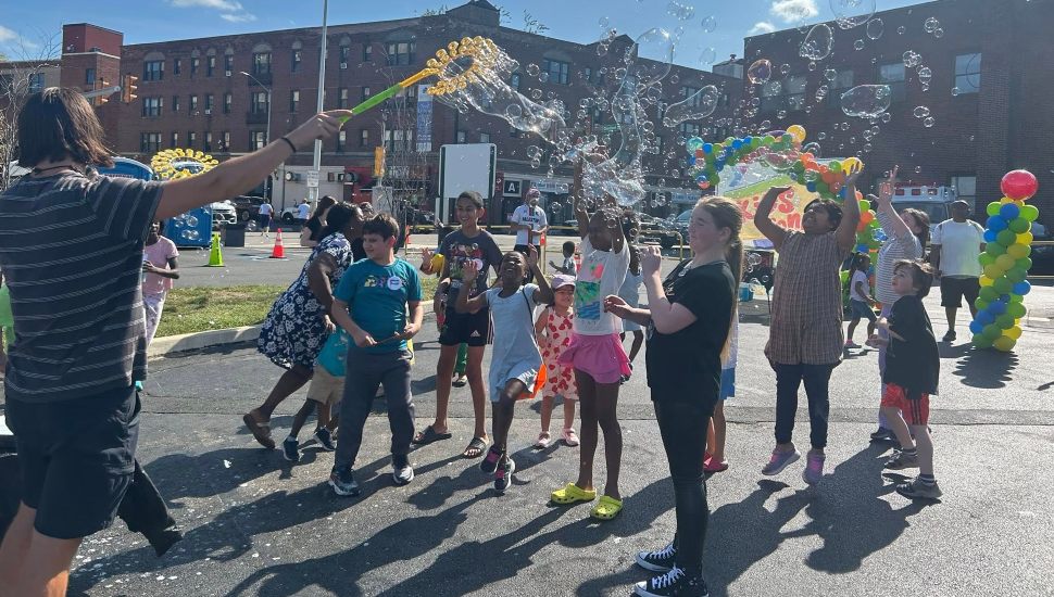 Children enjoy being showered with bubbles.