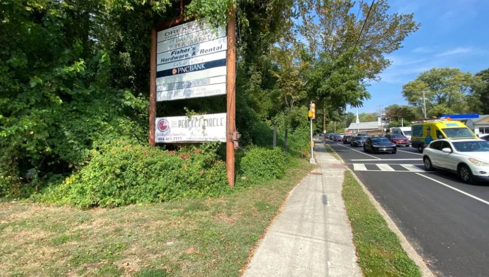A sign sits on undeveloped property near State and Township Line roads.