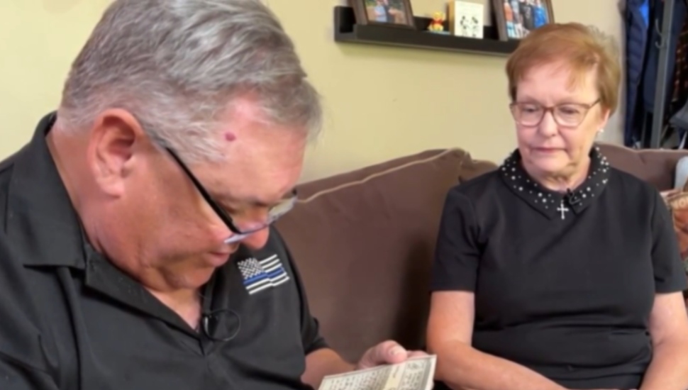 Siblings John Morris and Kathleen Morris Rosati look over letters sent by their late father while stationed overseas in World War II.