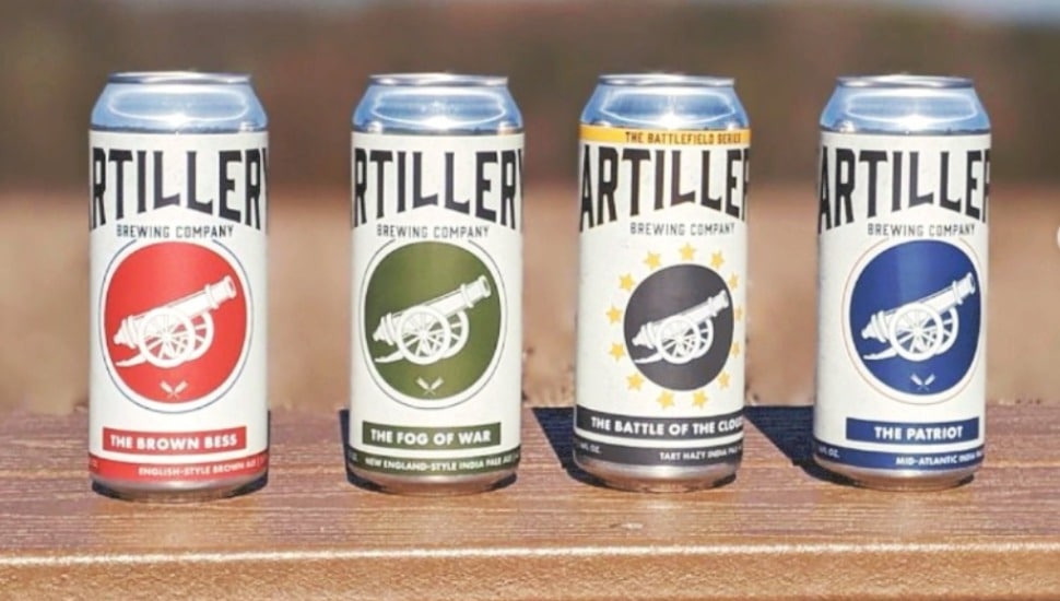 Artillery Brewing Company beer cans lined up.
