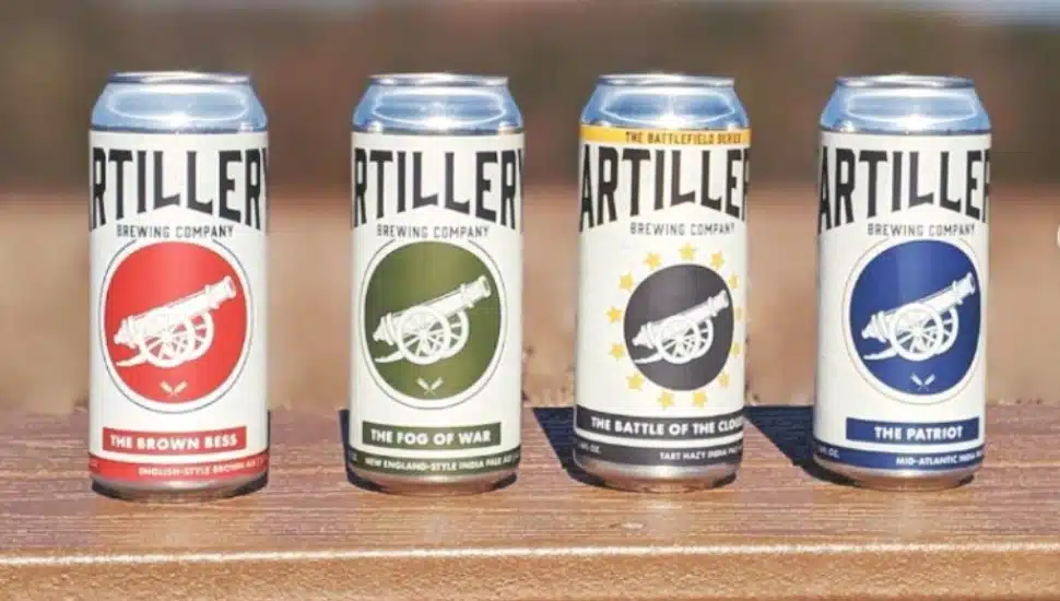 Artillery Brewing Company beer cans lined up.