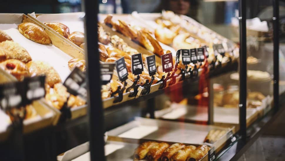 A display case of baked goods in a bakery.