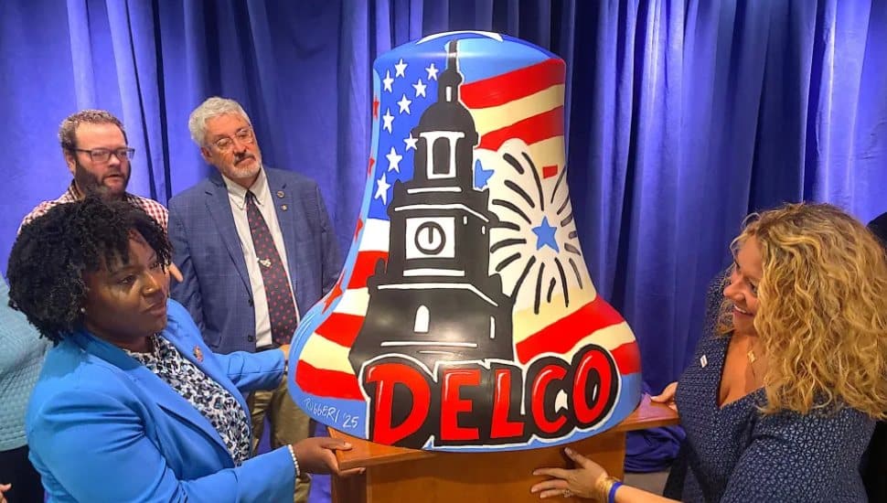 Joanna McClinton, speaker of the Pennsylvania House of Representatives, left, and continuing left, artist Joshua Ruggeri, state Sen. Tim Kearney and Cassandra Coleman, executive director, America250PA, with the Delaware County Bell