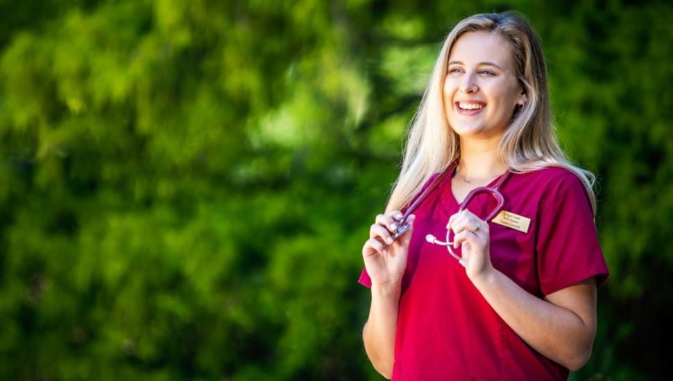 Female college student in nursing scrubs.
