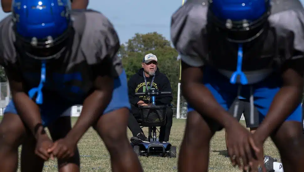 Academy Park Football Coach Refuses to Let Multiple Sclerosis Stop Him From Doing What He Loves