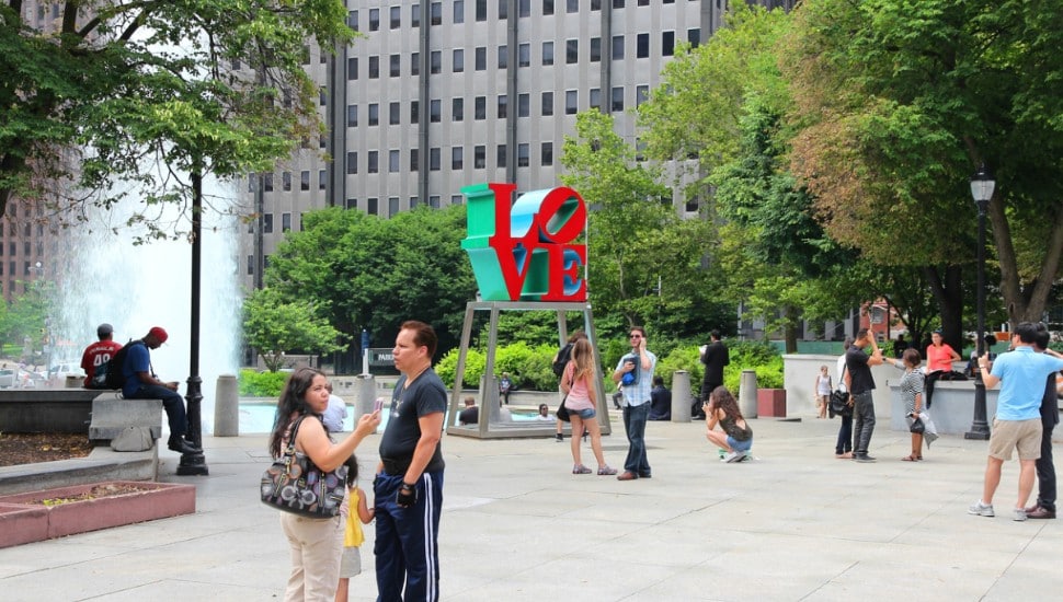 People mingling in Love Park in Philadelphia.