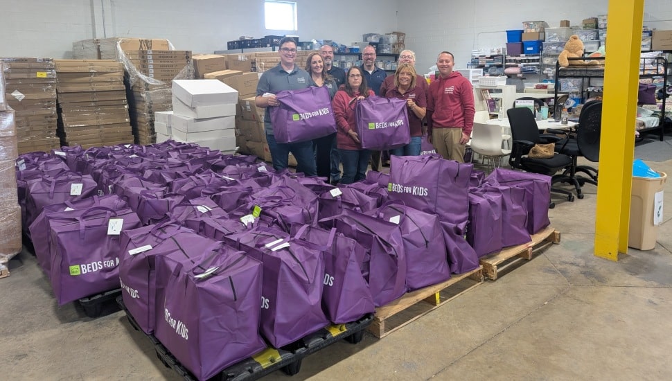 Volunteers pack donation bags at a nonprofit.