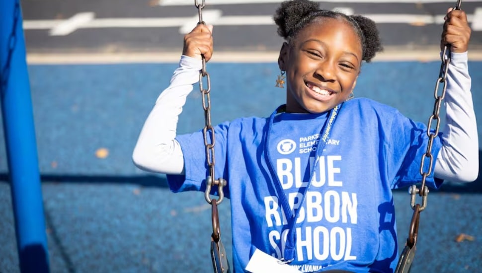 A Parkside Elementary School student celebrates her school's Pennsylvania Blue Ribbon award.