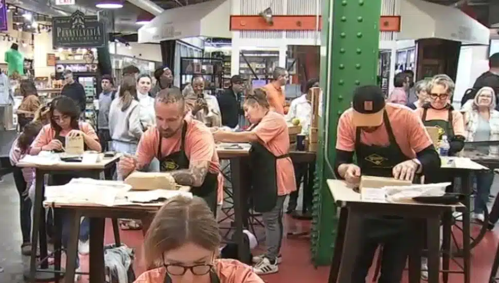 Contestants work on their scrapple sculptures at the Reading Terminal Market.