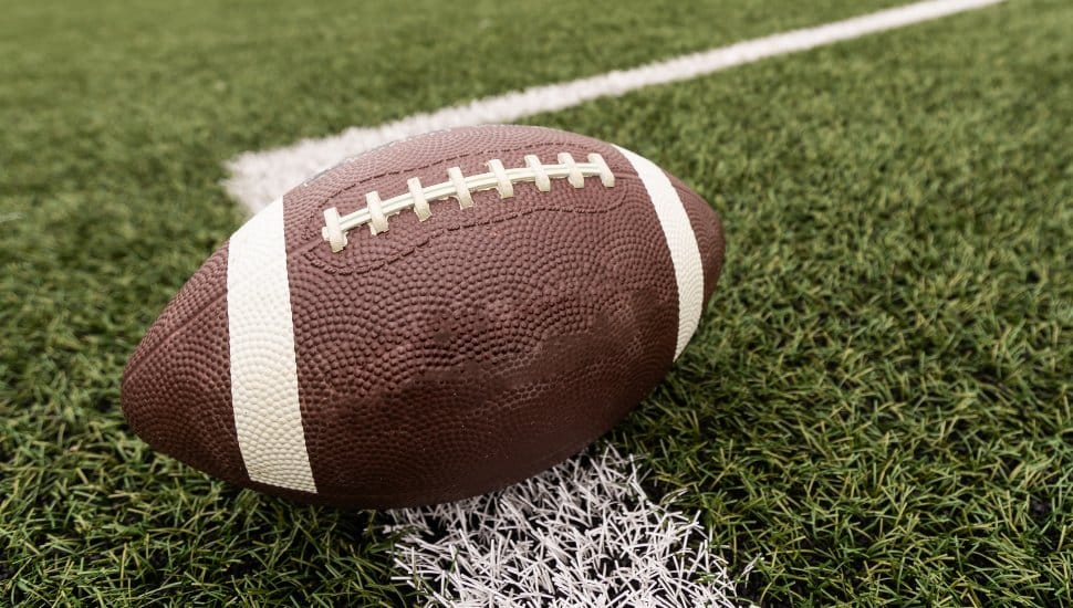 A football lying on the ground.