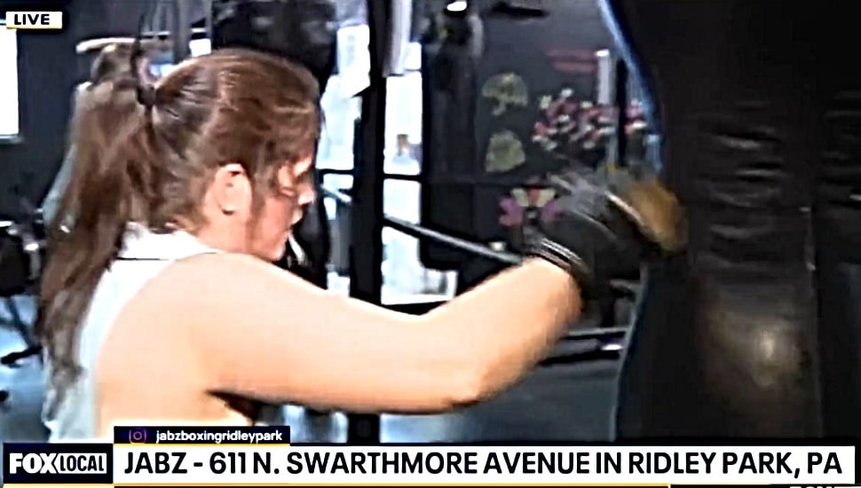 A woman works out with a punching bag at Jabz Boxing in Ridley Park.